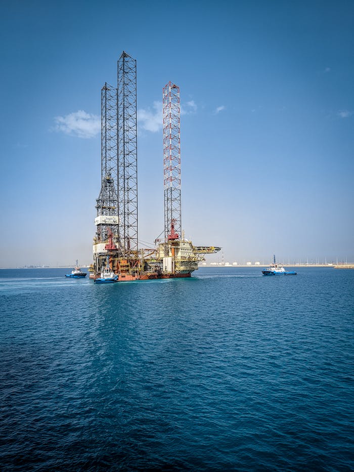 Stunning vertical shot of an offshore oil rig in the calm waters of Ras Laffan, Qatar.
